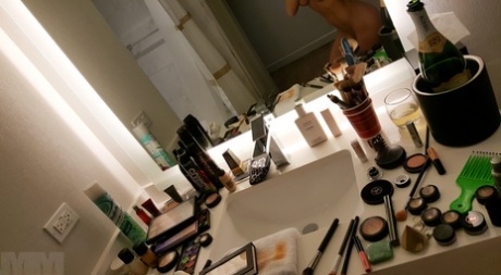 Amateur model takes naked and non naked bathroom selfies in mirror