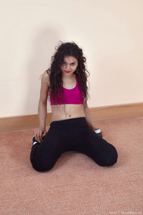 Brunette hottie in workout clothes Sierra spreads her tight and hairy vagina