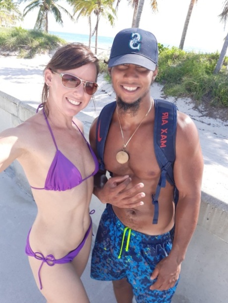 Saucy amateur MILF Riley Jacobs blows a stranger's BBC on the beach
