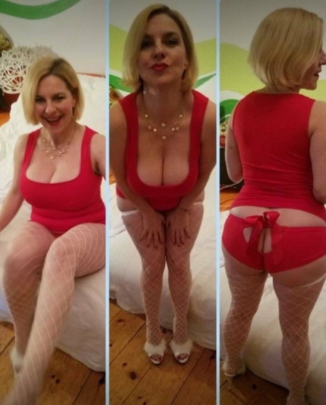 Mature seductress shows her hot cleavage & massages her big boobs